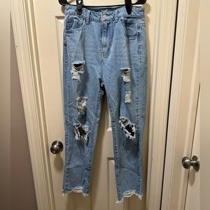 Ripped Jeans with rips at the bottom. Size large